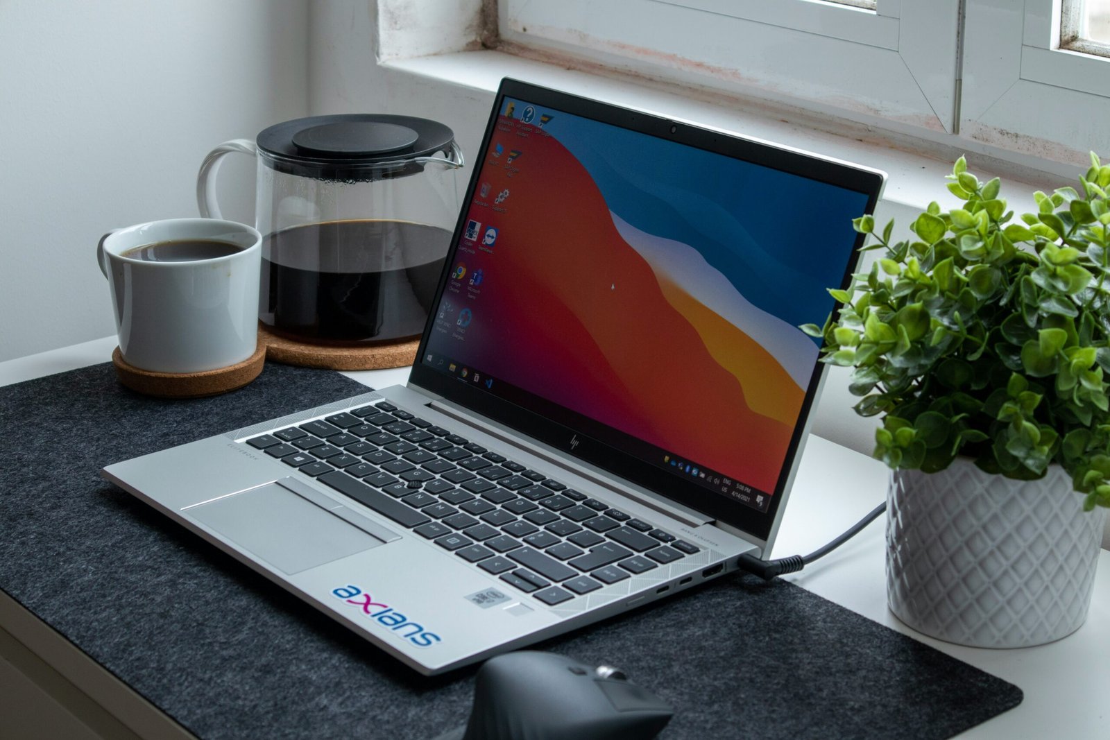 AI productivity workspace with laptop and notebook