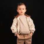 Child wearing a stylish leather jacket for kids