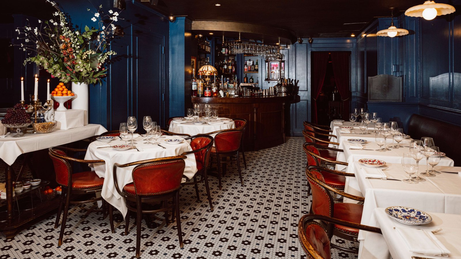 Carbone NYC dining room with red leather chairs