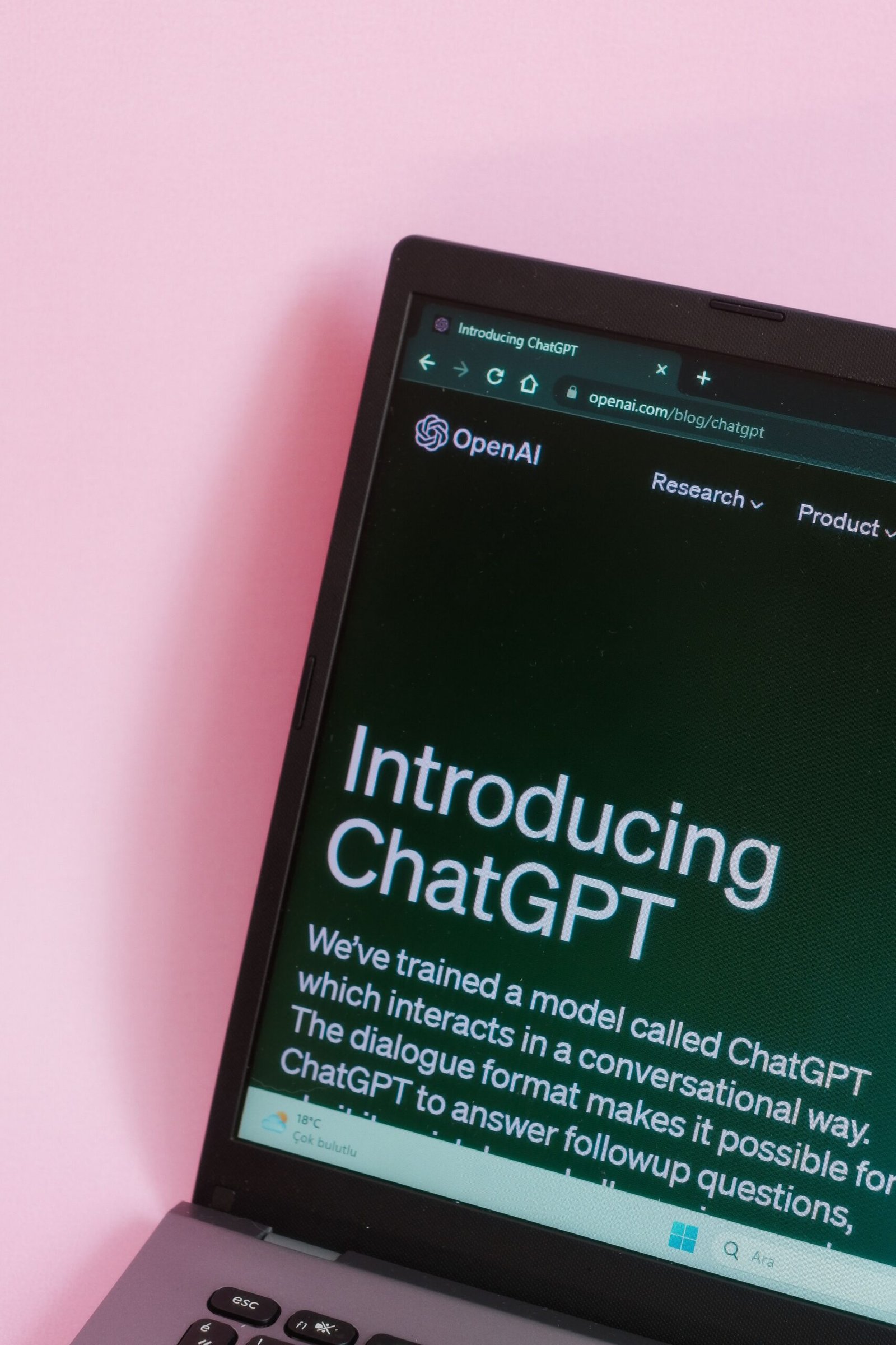 Laptop displaying ChatGPT AI interface for prompt learning