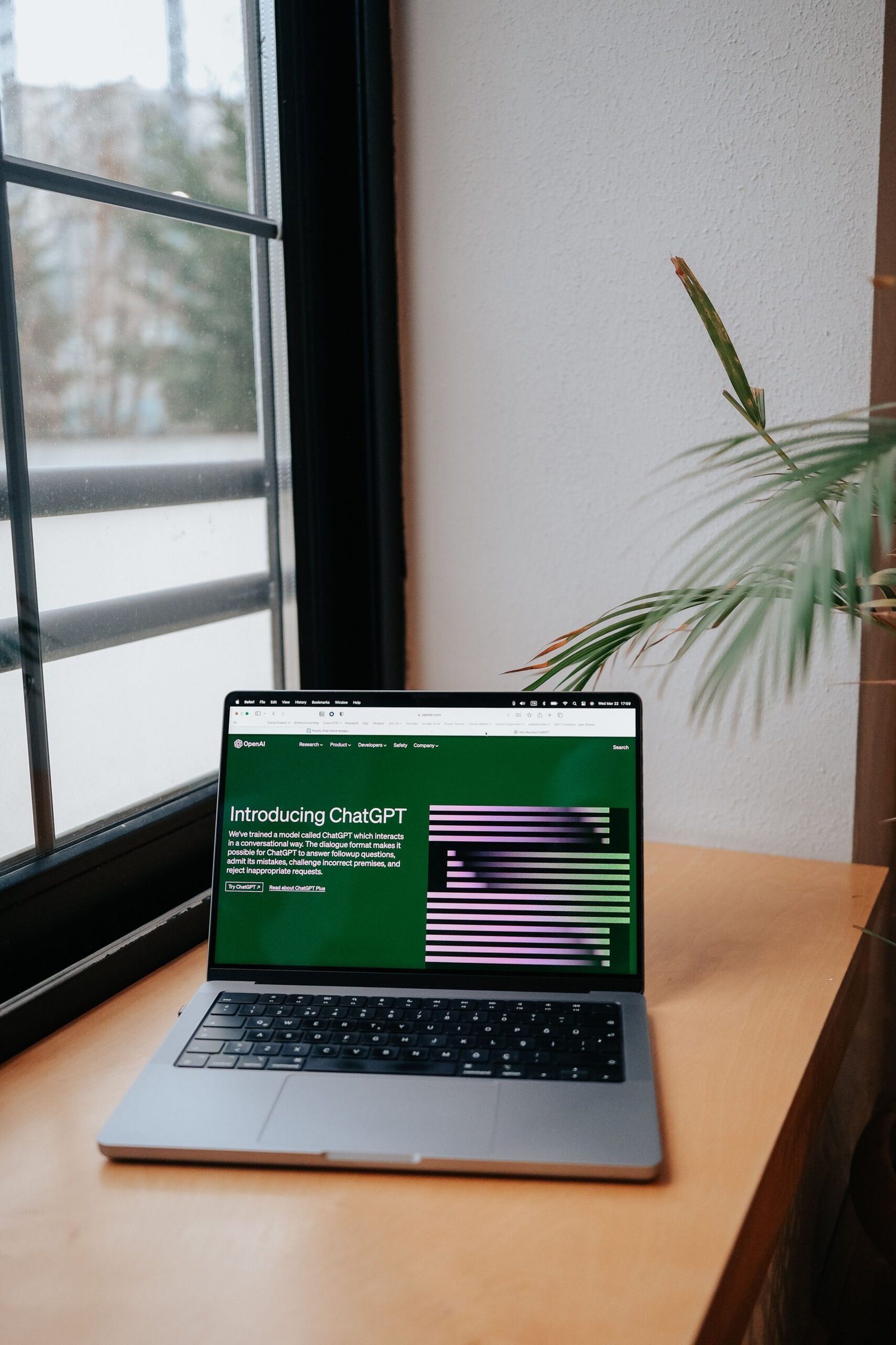 Laptop displaying an AI assistant workspace for prompt writing
