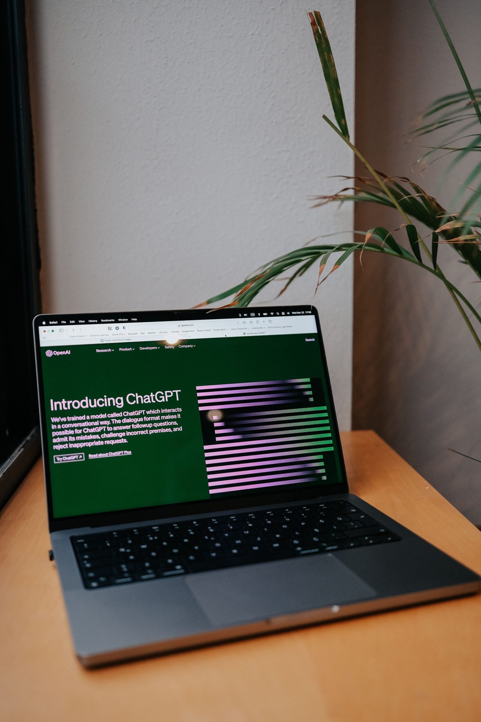 Laptop showing ChatGPT in a modern home office workspace