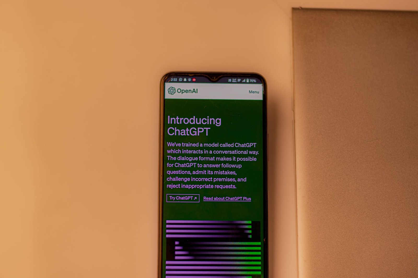 Mobile phone showing ChatGPT AI interface and introduction