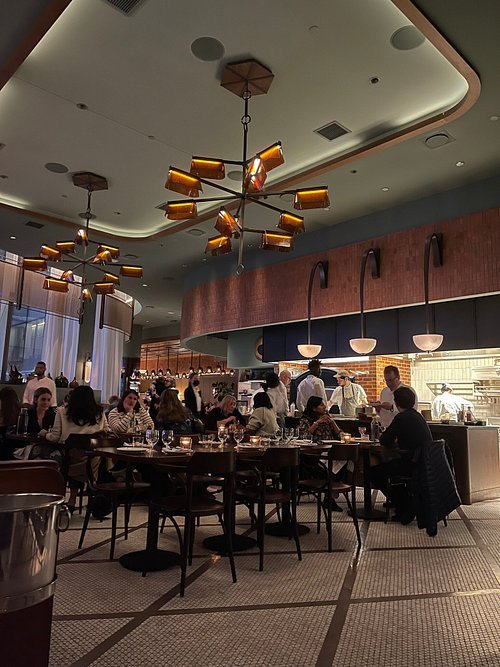 Ci Siamo restaurant interior in Manhattan West with open kitchen and dining room