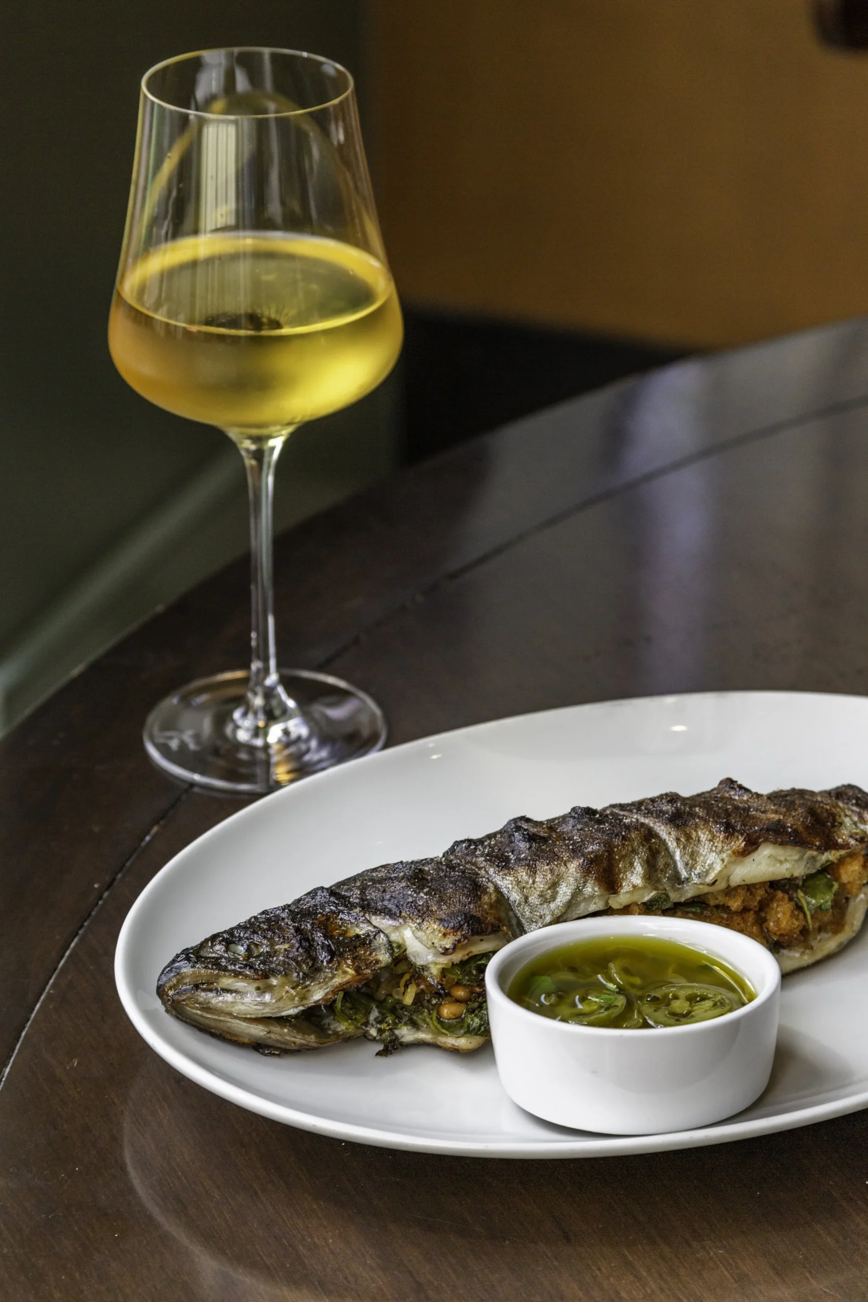 Ci Siamo NYC whole grilled trout with mustard greens and Italian vinaigrette