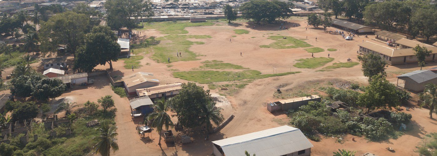 Aerial view of a school field in Ghana illustrating the MrBeast Ghana village story