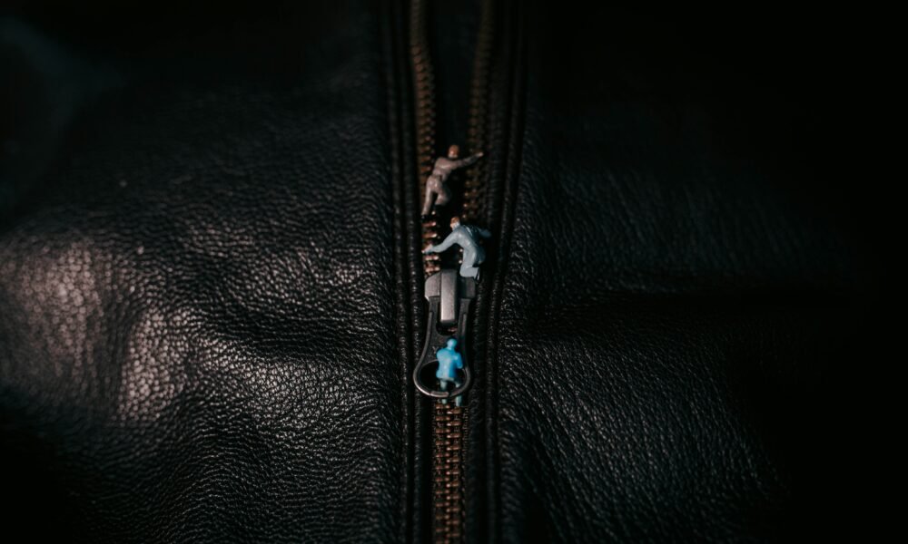 Black leather jacket material and zipper details