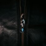 Black leather jacket material and zipper details