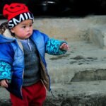 Boy wearing a casual jacket in a street style outfit
