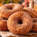 Apple cider donuts recipe with homemade cinnamon sugar donuts, fresh apples, and apple cider for a cozy fall treat.