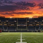 Generic football teams warming up under stadium lights before a night game
