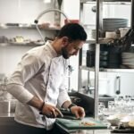 Restaurant chef working in a kitchen illustrating labor cost management