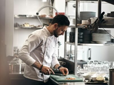Restaurant chef working in a kitchen illustrating labor cost management