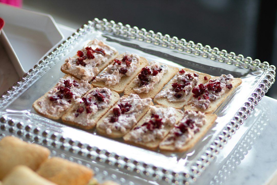 Holiday cranberry jalapeño dip appetizer served with crackers